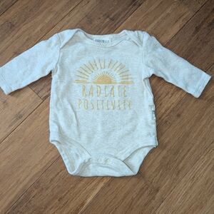 Rabbit + Bear long sleeve cream coloured bodysuit.